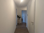 Flur - Neubau 3-Zimmer Wohnung mit großem Balkon, EBK und Aufzug !